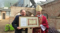 Bishop Steven Raica of Birmingham, Alabama, presented EWTN's vice president of theology, Colin Donovan, with the Pontifical International Marian Academy's Letter of Appointment and Diploma during a Mass on Aug, 9. | EWTN