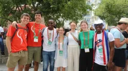 James Nyumah, 23, from Liberia, (pictured third from left) hangs out with new friends from Australia while attending a "Rise Up" session at World Youth Day 2023 in Lisbon, Portugal, on Aug. 2, 2023. | Hannah Brockhaus/CNA