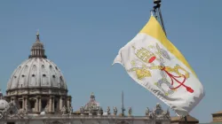 The flag of Vatican City with St. Peter's Basilica in the background. Credit: Bohumil Petrik/CNA