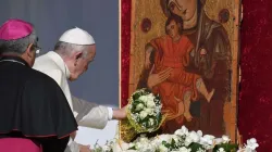 Pope Francis places a bouquet before a Marian icon in Piazza Armerina, central Sicily, Sept. 15, 2018. Credit: AFP via Getty Images