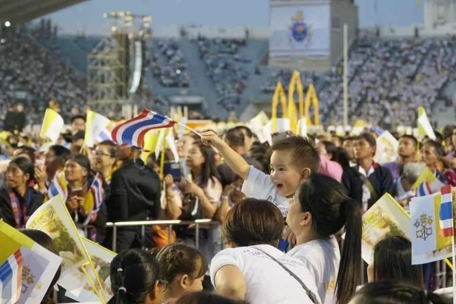 A young boy waves a Thai flag before Mass with Pope Francis in Bangkok, Thailand. Credit: Hannah Brockhaus/CNA.
