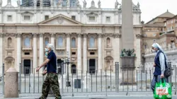People pass in front of St. Peter's Basilica at the end of May 2020. Credit: Daniel Ibanez/CNA.