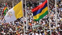 People wave flags during Mass with Pope Francis in Port Louis, Mauritius Sept. 9, 2019. Credit: Edward Pentin/CNA