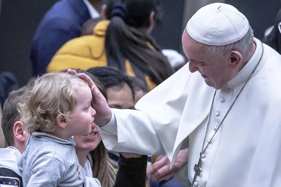 Pope Francis blesses a child on Jan. 12, 2020. Credit: Daniel Ibanez/CNA.