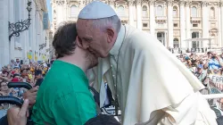Pope Francis embraces a man in a wheelchair at the Wednesday general audience in St. Peter's Square on June 10, 2015. L'Osservatore Romano.