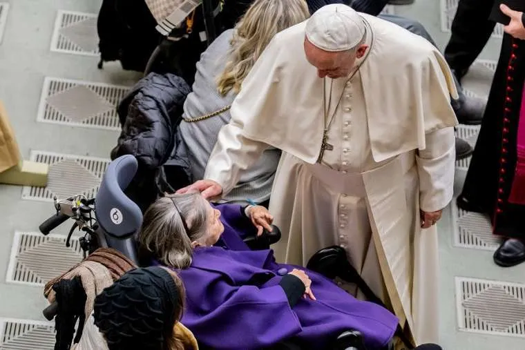 Pope Francis greets a woman before the general audience Dec. 19, 2018. Credit: Daniel Ibanez/CNA.