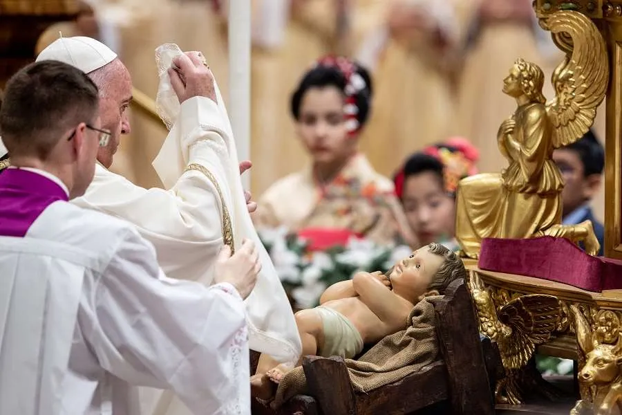 Pope Francis uncovers the Child Jesus in St. Peter's Basilica Dec. 24, 2019. Credit: Daniel Ibanez/CNA.