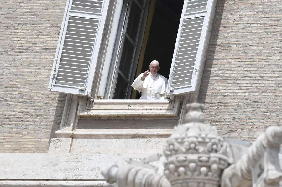 Pope Francis waves from a window of the apostolic palace May 10, 2020. Credit: Vatican Media.