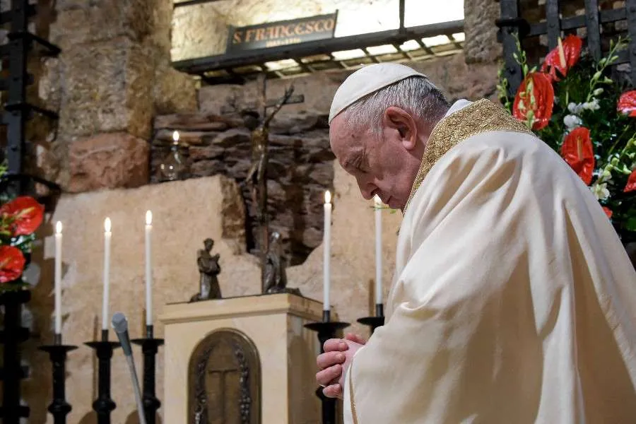 Pope Francis prays at the tomb of St. Francis of Assisi Oct. 3, 2020. Credit: Vatican Media.