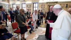 Pope Francis waves to a child at an audience with representatives of the Ambulatorium Sonnenschein in St. Pölten, Austria. Credit: Vatican Media.