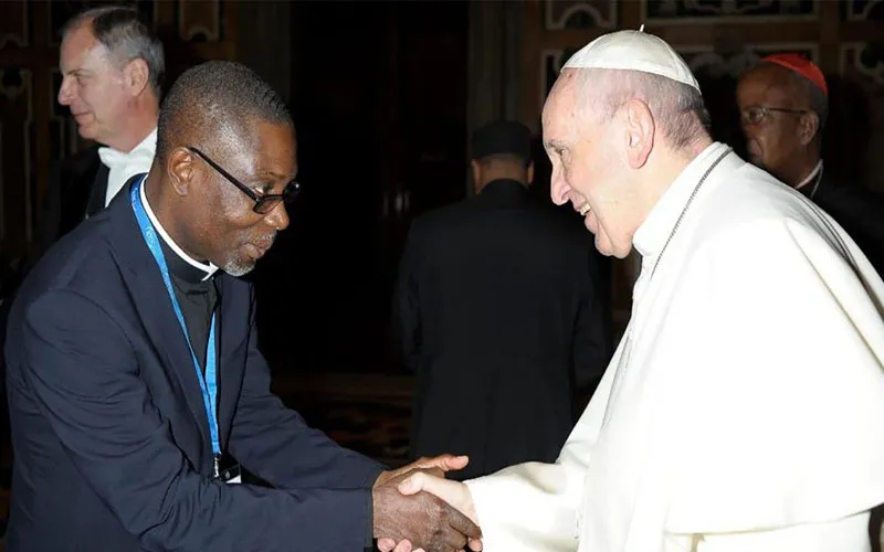 Mons. Joseph Kakou Aka greets Pope Francis in Rome. Credit: Courtesy Photo