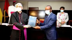 The Apostolic Nuncio in Angola, Archbishop Giovanni Gaspari receives the regulatory and administrative instruments of the Framework Agreement signed between the Holy See and the Republic of Angola in 2019 from Angola's Minister of State and Head of the Civil Cabinet of the President of the Republic, Adão de Almeida. Credit: Courtesy Photo
