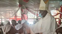Archbishop Ignatius Kaigama administering the Sacrament of Baptism during Holy Mass Sunday, January 10. / Archdiocese of Abuja
