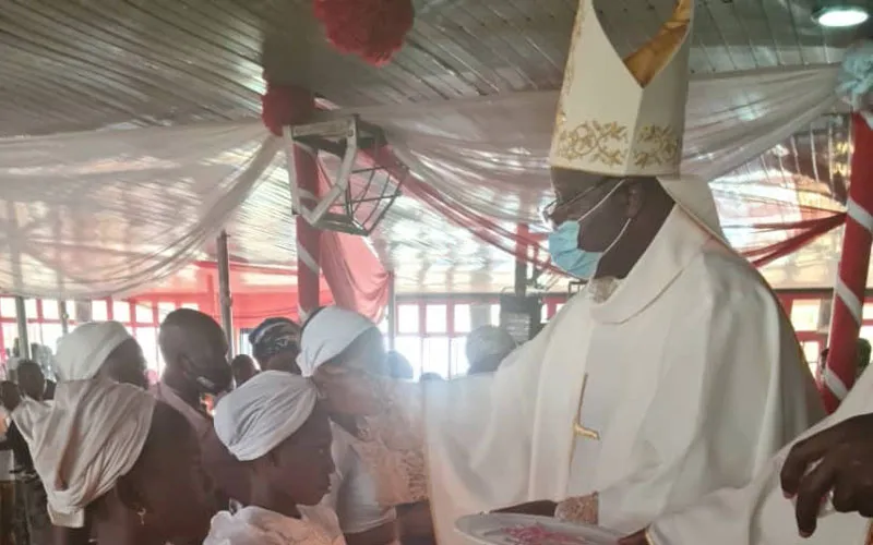 Archbishop Ignatius Kaigama administering the Sacrament of Baptism during Holy Mass Sunday, January 10. / Archdiocese of Abuja