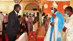 Archbishop Roger Houngbédji greets Benin's president of the constitutional council Joseph Djogbenou during the prayer service at Our Lady of Mercy Cathedral in Cotonou Archdiocese. / Courtesy Photo