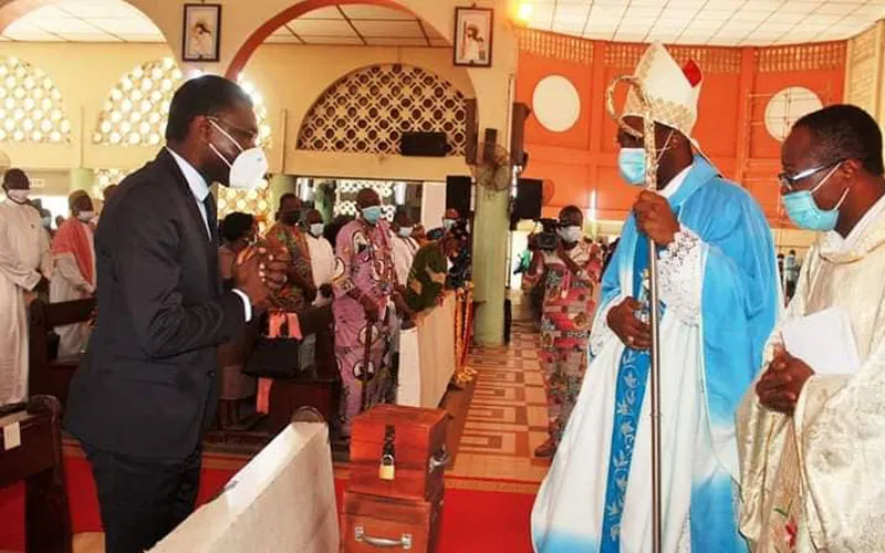 Archbishop Roger Houngbédji greets Benin's president of the constitutional council Joseph Djogbenou during the prayer service at Our Lady of Mercy Cathedral in Cotonou Archdiocese. / Courtesy Photo