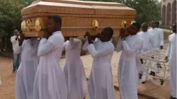 Seminarians carry the coffin of their colleague Michael Nnadi during his burial on February 11
