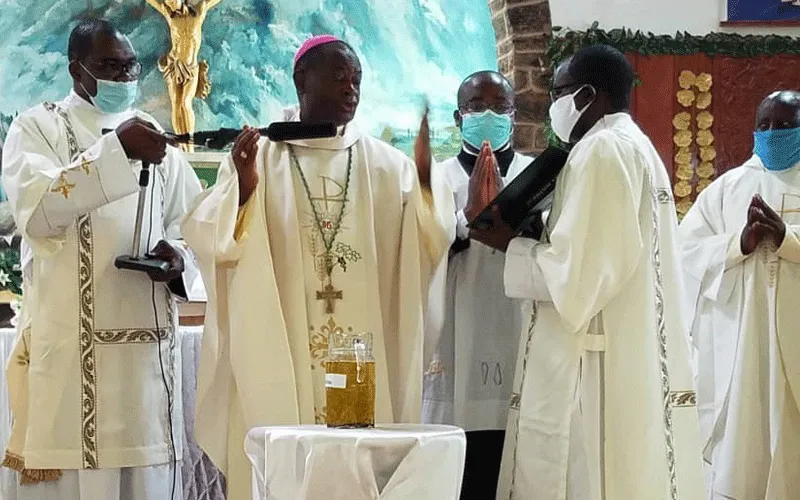 Bishop George Nkuo of the Catholic Diocese of Kumbo in Cameroon blessing the oils at the Chrism Mass Thursday, May 28, 2020. / Deacon Leonard Nyuydze