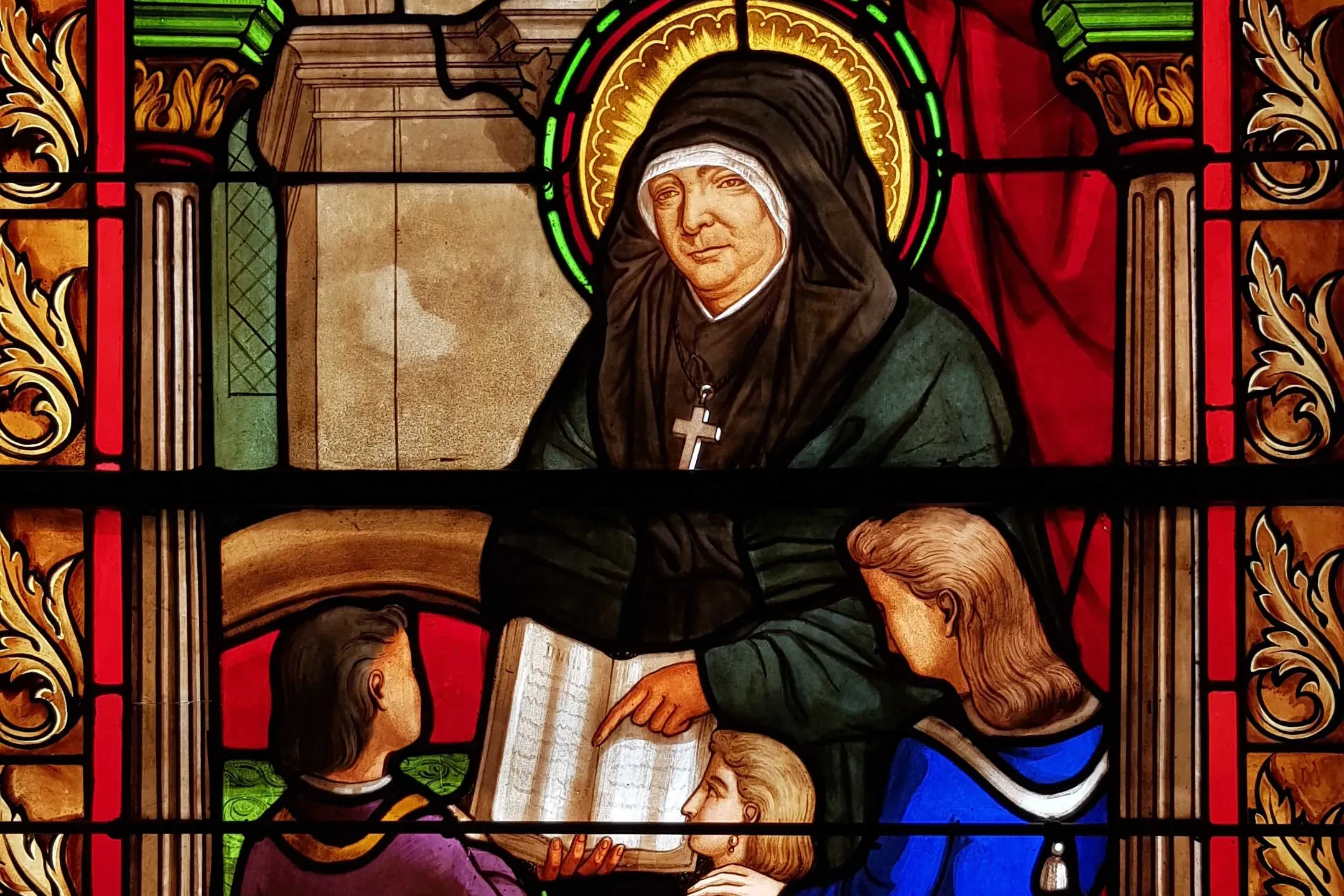 A stained glass window depicting Blessed Marie Rivier in the motherhouse of Sisters of the Presentation of Mary in France. Public domain