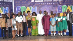 The three Grand Finale contestants with Archbishop Kwofie, Episcopal Chairman of Education in Ghana, Priests and dignitaries at the maiden Science and Maths Brain Battle Quiz for Catholic Schools in Accra on March 15, 2020. / Damian Avevor