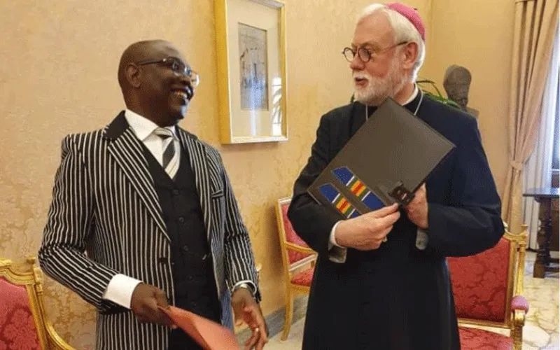 Archbishop Paul Richard Gallagher (right), Vatican's Secretary for Relations with States and Mr. Robert Compaore (left), Ambassador of Burkina Faso to the Holy See during the exchange of the Instruments of Ratification of the Agreement between the Holy See and the State of Burkina Faso on the legal status of the Catholic Church in Burkina Faso. / Holy See Press Office