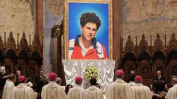 An image of Carlo Acutis was unveiled at his beatification Mass in Assisi, Italy Oct. 10, 2020. / Daniel Ibanez/CNA