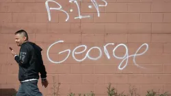 RIP George has been painted on a wall after a night of protests and violence on May 29, 2020 in Minneapolis, Minnesota / Scott Olson/Getty Images