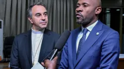 Archbishop Ettore Balestrero (left) and Minister Patrick Muyaya (right) addressing journalists after the first preparatory meeting ahead of the Pope's July 2-5 trip to DRC. Credit: Primature RDC/Facebook