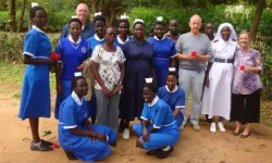 Dr. Erik  Domini (on the front row) poses for a photo with staff and midwifery students at Kalongo hospital in Northern Uganda. Erick is the doctor who asked to pray seeking the intercession of Fr. Ambrosoli for a woman who was in a comma. Credit: Fr. Egidio Tocalli/ Comboni Missionaries