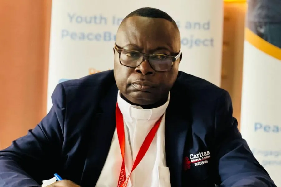 Caritas Freetown Executive Director Fr. Peter Konteh makes a presentation during the training organized for violence incidence monitors and reporters ahead of Sierra Leone's Saturday, June 24vGeneral elections. Credit: Caritas Freetown Media team