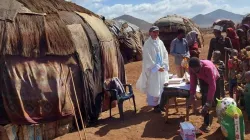 Food donation after Mass at a settlement in Chalbi Desert that is served by Kenya's Catholic Diocese of Marsabit. Credit: Fr. Aurelian Herciu