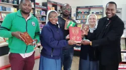 Fr. Paul Ndungu of Kenya's Nyahururu Diocese (right), the first Priest to purchase the newly published Swahili Liturgical Books on 14 August 2021 at the Paulines Communication Centre in Nairobi, pose for a photo alongside two Daughters of St Paul, Sr. Clara Zaniboni (next to Fr. Paul) and Sr. Metrine Nafula (between two customers). Credit: Sr. Olga Massango/Daughters of St Paul, Nairobi
