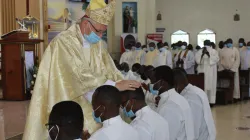 Archbishop Hubertus van Megen laying hands on the candidates for ordination during Mass at the St. John the Evangelist Parish, Karen of the Archdiocese of Nairobi. / ACI Africa