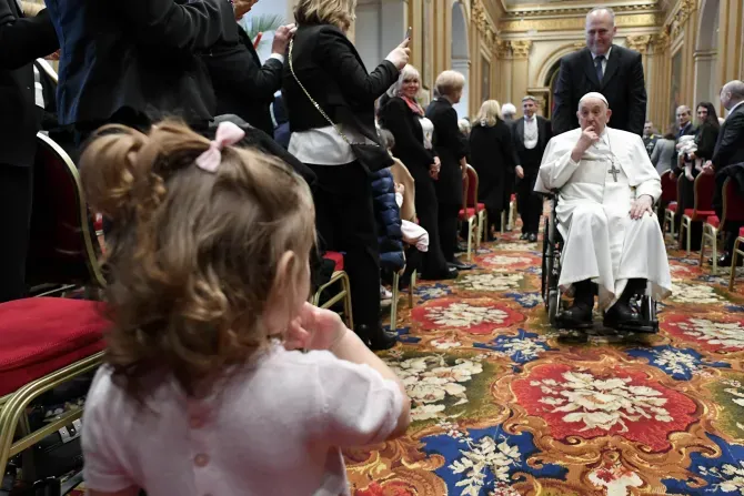 Pope Francis engages with a youngster at the inauguration of the 95th Judicial Year of the Vatican City State on Saturday, March 2, 2024. | Credit: Vatican