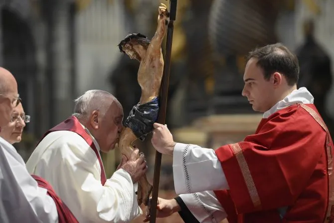 Pope Francis kisses the crucifix at the Liturgy of the Lord's Passion in St. Peter's Basilica on April 7, 2023. | Vatican Media