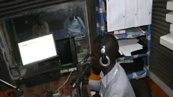 A journalist working in the studio of Emmanuel Radio, South Sudan.
