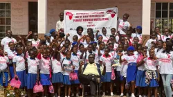 Fr. Peter Konteh (seated), poses for a photo session with beneficiaries of Desert Flower Foundation- Sierra Leone on the celebrations of International Day of Zero Tolerance for Genital Mutilation. Credit: Fr. Peter Konteh