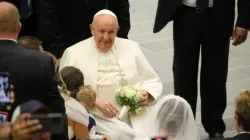 Pope Francis greets newly married couples at the general audience in the Vatican's Paul VI Hall on Aug. 30, 2023. | Adi Zace/CNA