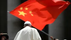 A worshiper waves the flag of China as Pope Francis leaves following the weekly general audience on June 12, 2019, at St. Peter's square in the Vatican. | Photo by FILIPPO MONTEFORTE/AFP via Getty Images