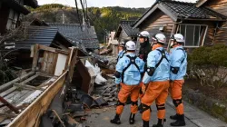 Firefighters inspect collapsed wooden houses in Wajima, Ishikawa Prefecture, on Jan. 2, 2024, a day after a major 7.6-magnitude earthquake struck the Noto region in Ishikawa Prefecture. | Credit: KAZUHIRO NOGI/AFP via Getty Images