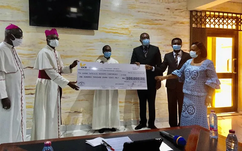 Archbishop Charles Palmer-Buckle, Vice President of the Ghana Catholic Bishops’ Conference receiving a Cheque for GHc100,000 ($20,000) from the leadership of the Knights and Ladies of Marshall, a Catholic Friendly Society in Ghana at National Catholic Secretariat on April 15, 2020. / Marshallan Communications Team.