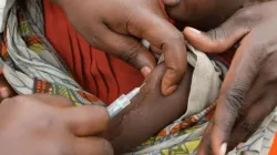 A child being administered the meningitis vaccine.