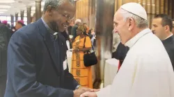 Bishop Richard Kuuia Baawobr with Pope Francis in the Vatican.