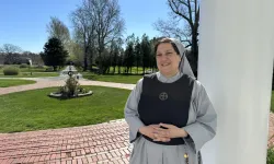 Mother Marla Marie stands on the front porch of the sisters’ Mother of the Light convent in Dartmouth, Massachusetts. / Credit: Joe Bukuras/CNA