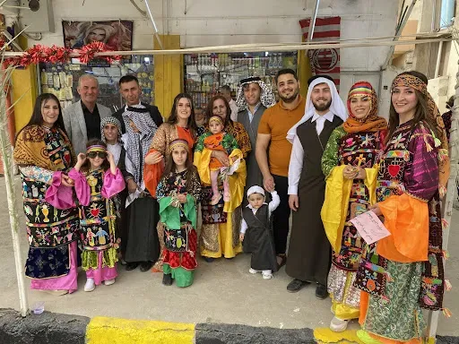A Christian family in Qaraqosh sporting their traditional dressing for Holy Week in April 2022. Bashar Yameel Hanna/CNA