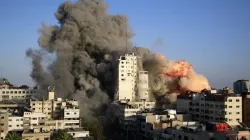 Image of buildings burning in the ongoing Israeli-Palestinian violence. Credit: Courtesy Photo