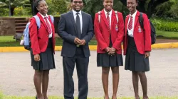 St. George's College Rector Fr. Joe Arimoso (second left) with some of the girls enrolled in the school. / St. George's College/ Facebook