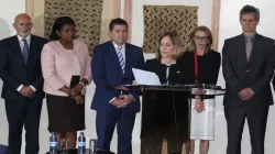 US government Head of Delegation Valerie Huber (on mic) reads the joint statement by ten countries flanked by various government representatives who are party to the statement. / ACI Africa