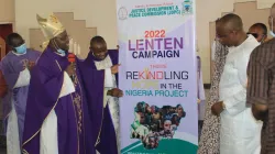 Archbishop Ignatius Kaigama unveils a banner for the 2022 Lenten Campaign message in Abuja Archdiocese. Credit: Abuja Archdiocese