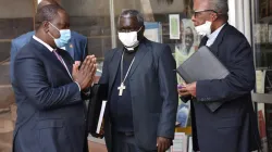 John Cardinal Njue (right), Archbishop Philip Anyolo (Center) and CS Mutahi Kagwe (left) during Tuesday's meeting at the Holy Family Basilica in Nairobi, Kenya. / KCCB